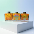 Three bottles of Spicy Mamasitas Hot Sauce Trio featuring vibrant labels and different spicy flavors from Spicy Mamasitas Hot Sauces.