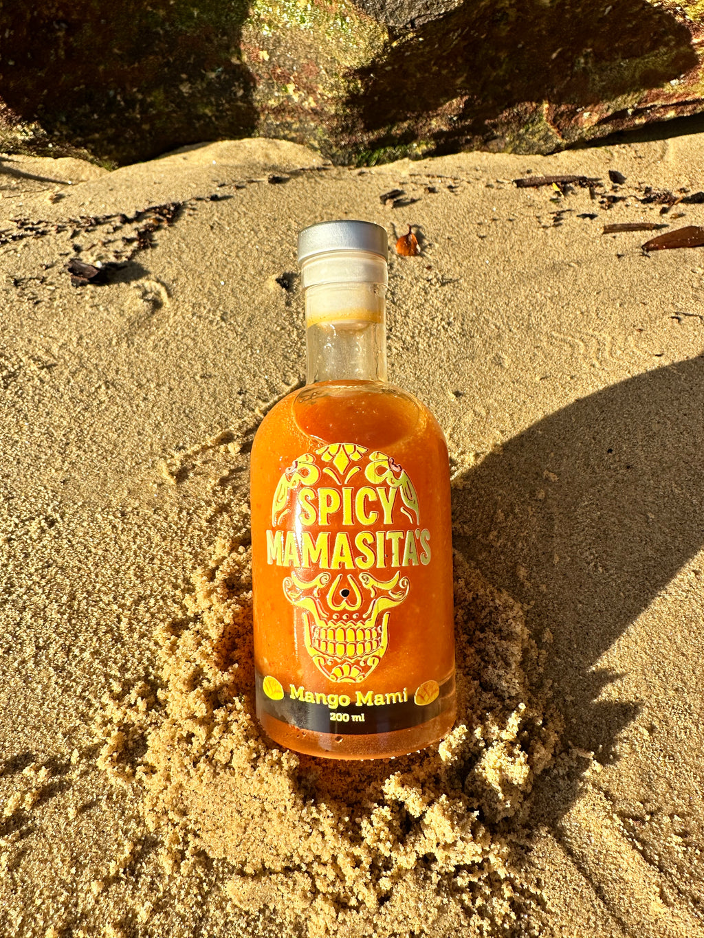 Spicy Mango Mami Hot Sauce bottle from My Store with bright label and colorful peppers, ready for adding flavor to dishes.