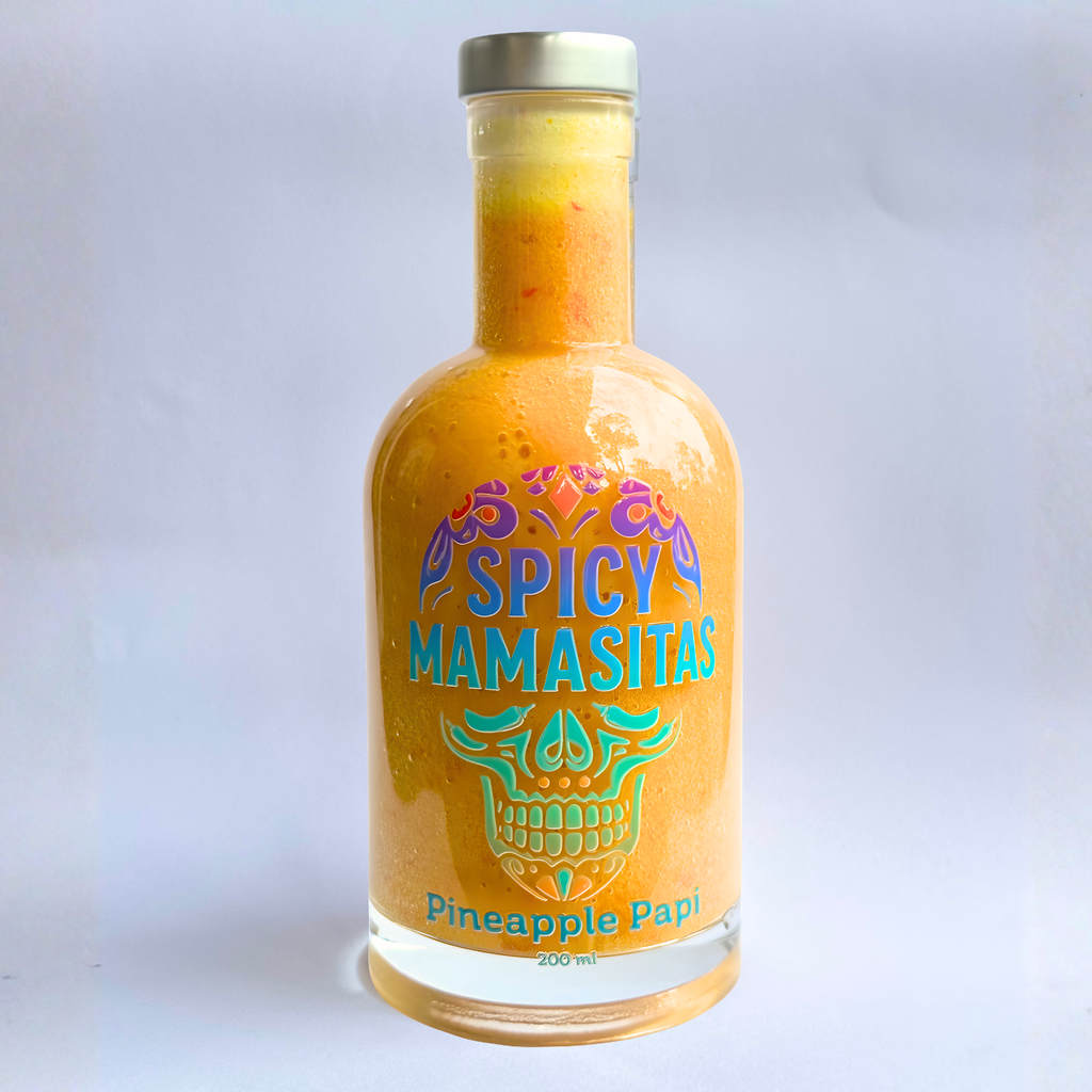 Square bottle of Pineapple Papi Hot Sauce by My Store with a white label and pineapple graphic on the front.