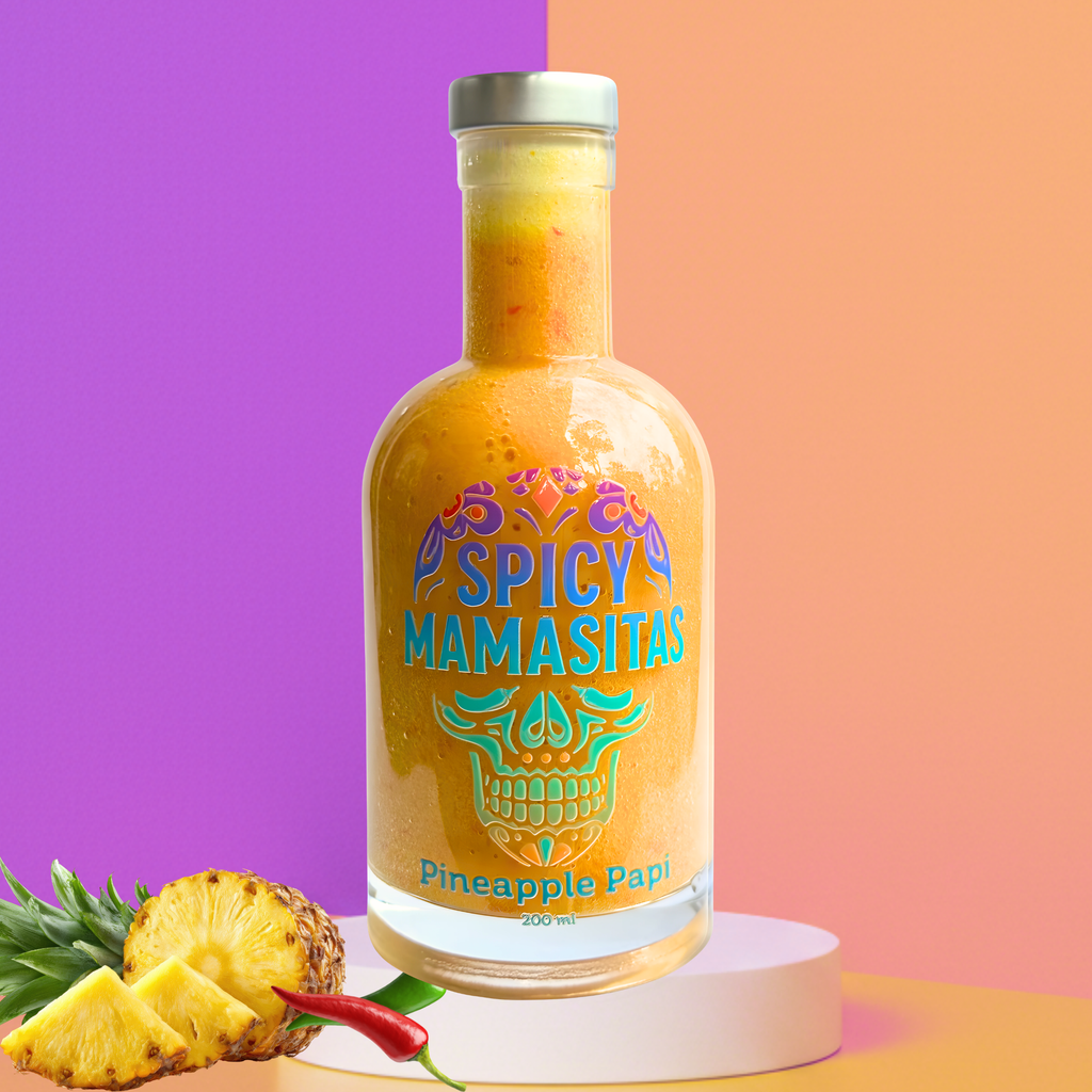 Colorful image of Pineapple Papi Hot Sauce bottle from My Store on a vibrant podium, highlighting the bright pineapple label and packaging.