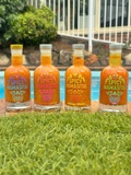 Set of four spicy hot sauces from Spicy Mamasitas Hot Sauces, showcasing vibrant bottles of flavorful, fiery condiments.